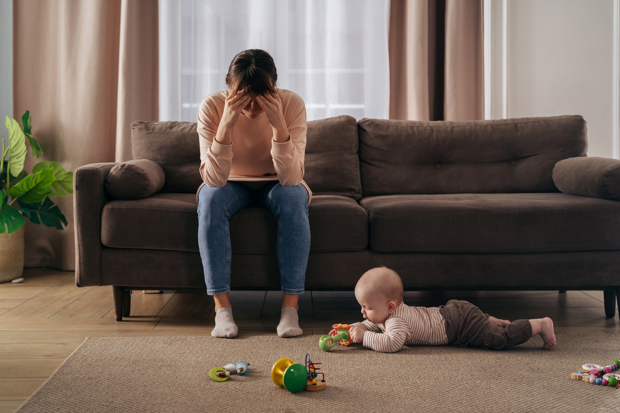 Desperate mother tired from motherhood and suffering from depression